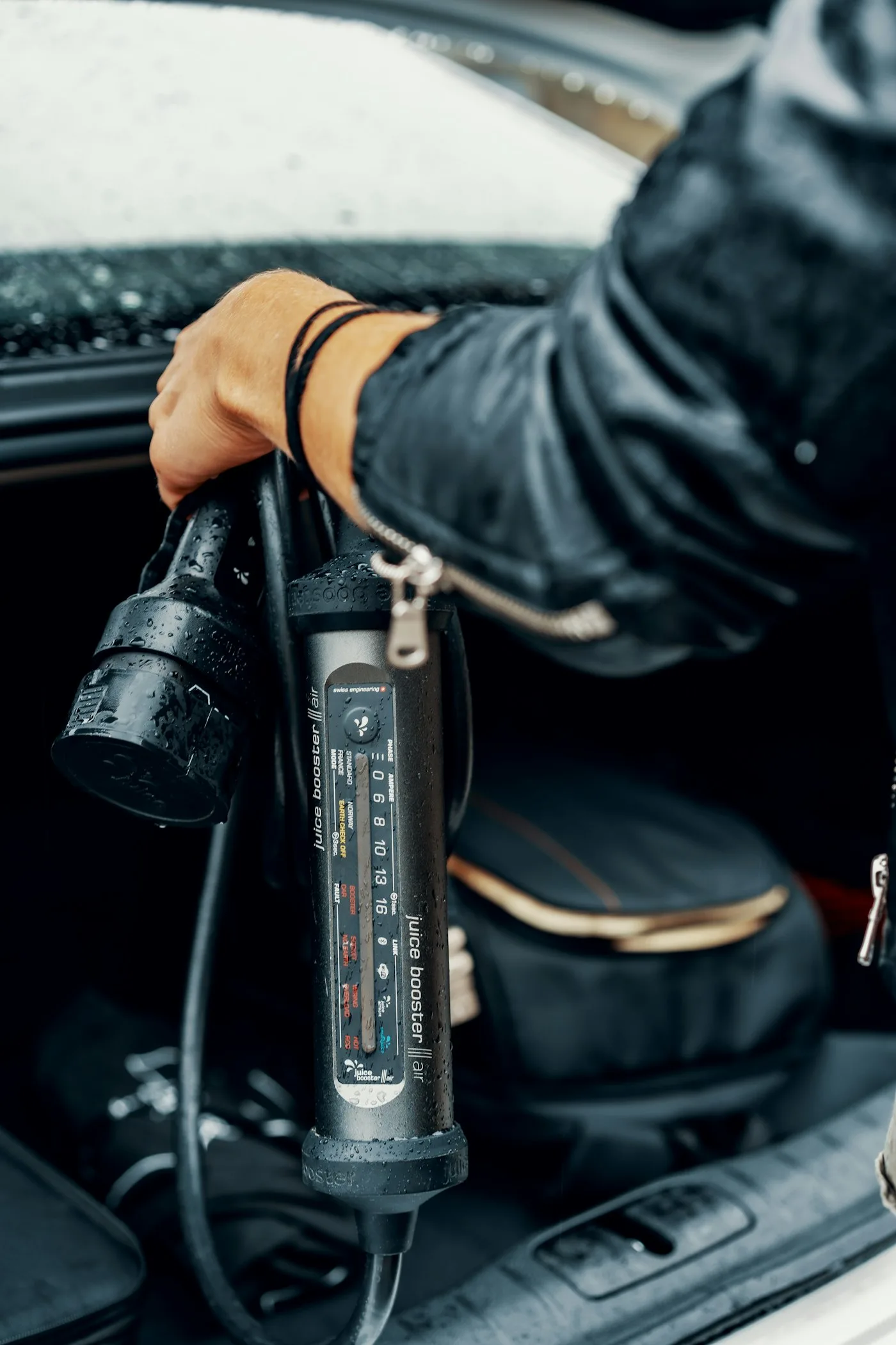 Portable EV charger stored in a car boot